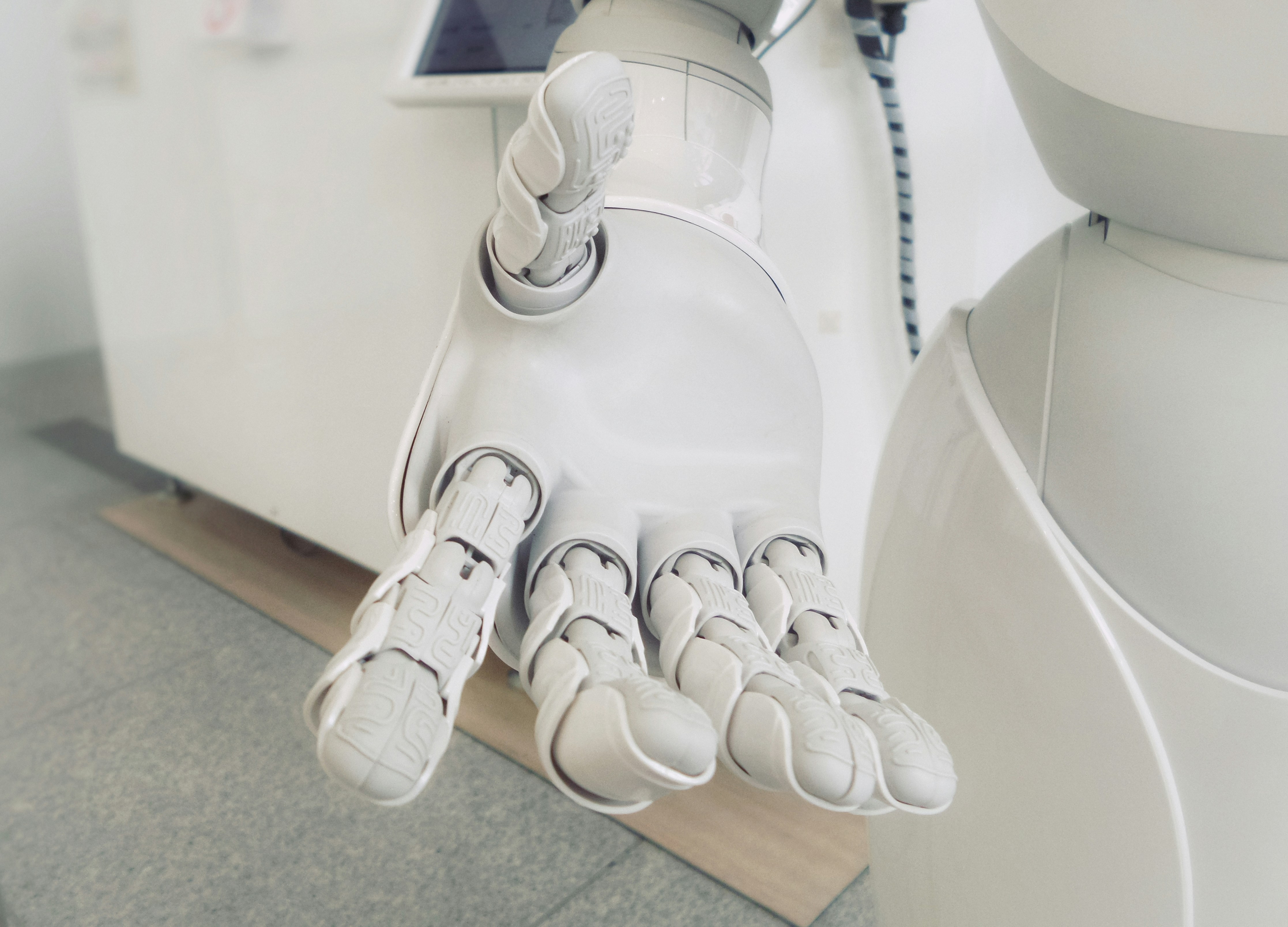 White robot arm close-up - Even in the AI era, the web must be for everyone